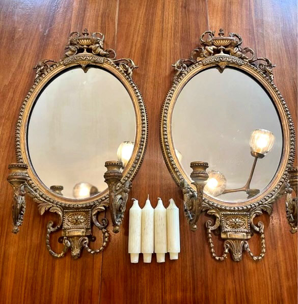 009a - Pair of Victorian wall mirrors with double candeholders and cupids on the crown, 24 in. T.